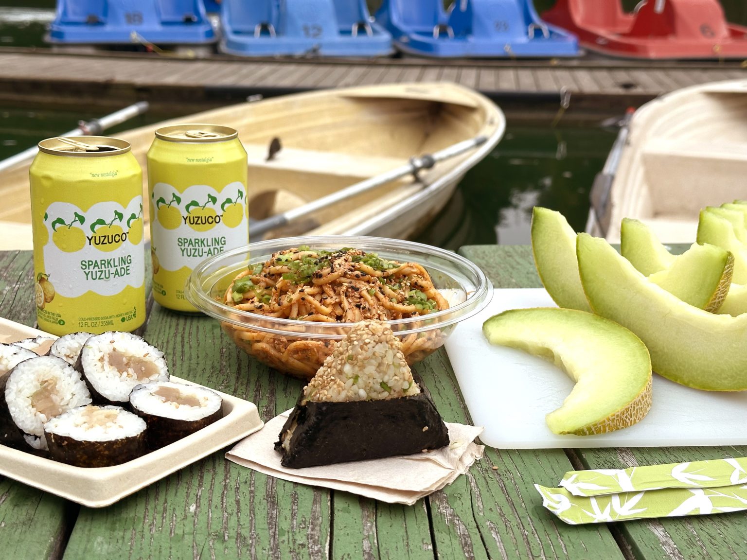 Summer Picnic With Onigiri And Yuzuade In Front Of Stow Lake Boats Closeup