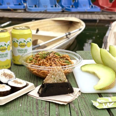 Summer Picnic With Onigiri And Yuzuade In Front Of Stow Lake Boats Closeup