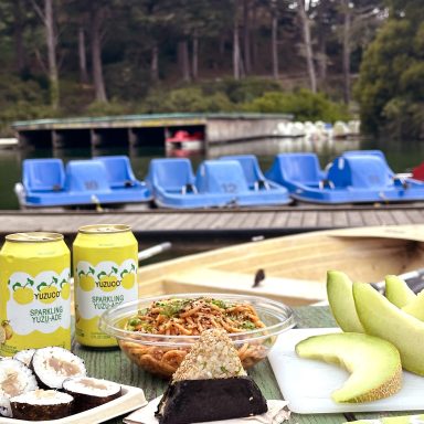 Summer Picnic With Onigiri And Yuzuade In Front Of Stow Lake Boats With Some Of The Lake And Trees In Background
