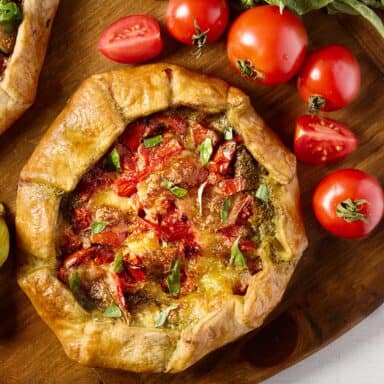 Early Girl Tomato Gallete On Wood Board With Ingredients