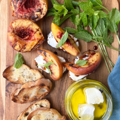 Grilled Peached On Wood Slab With Drizzle On Toast Points
