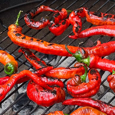Jimmy Nardello Peppers Charring On An Outdoor Grill