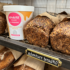 Josey Baker ice cream collaboration pint next to adventure bread on shelf